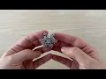 Spilla con strass, motivo: fiocco di neve, girevole